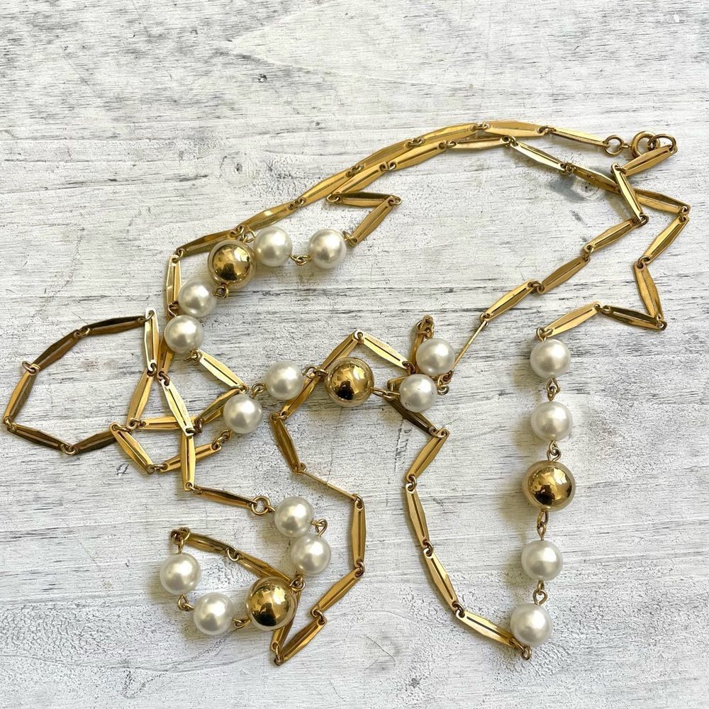 Gold tone faux pearl long necklace